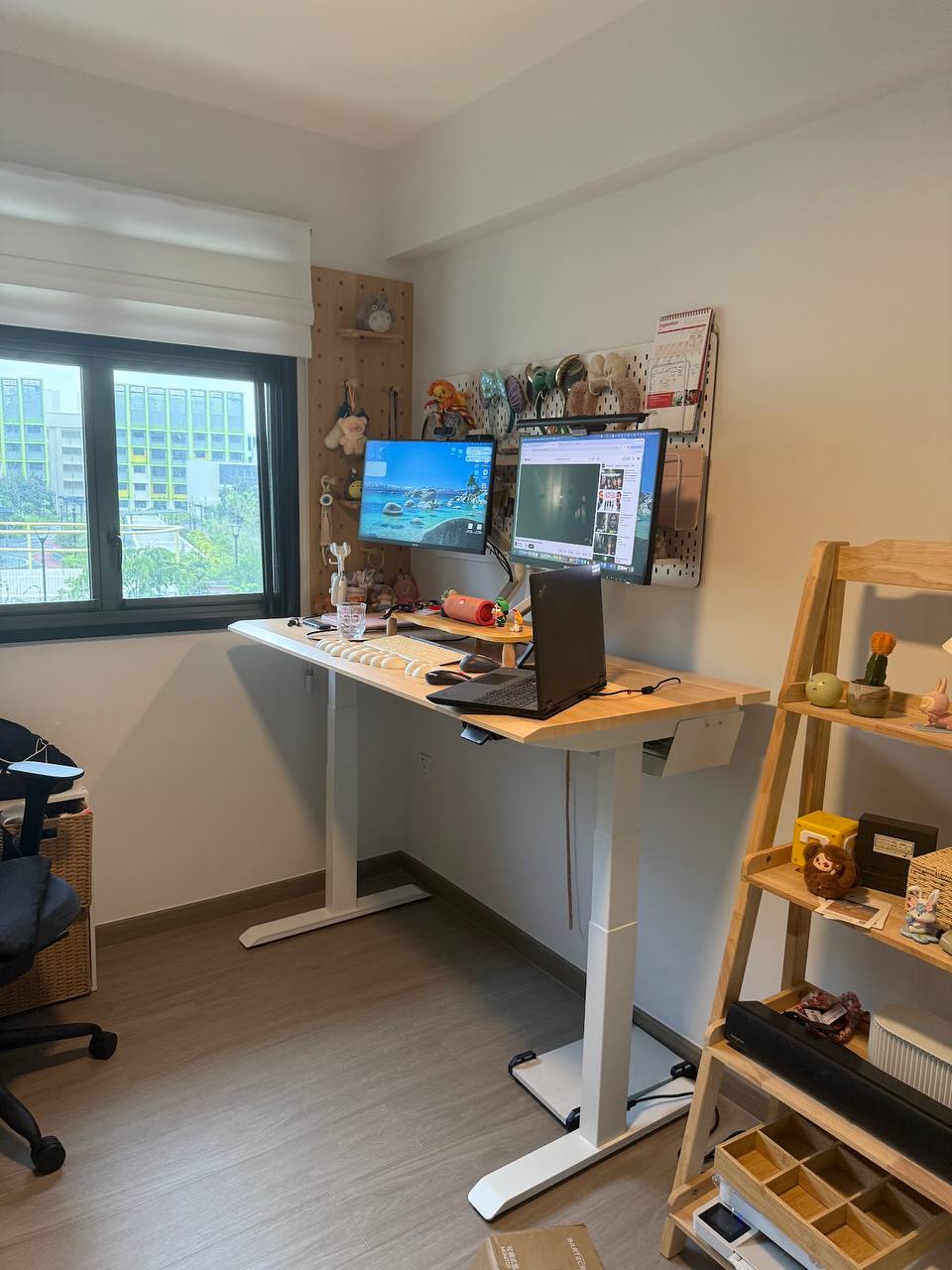 Premium ULTI gaming desk setup against a dark timber feature wall